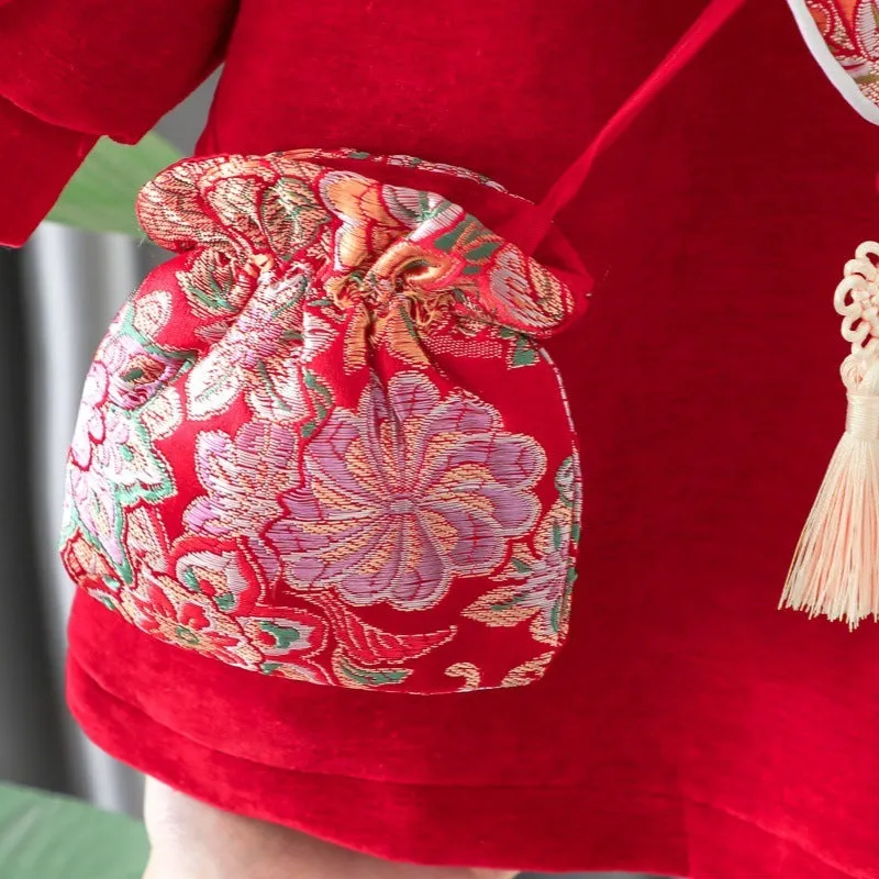 Girls winter velvet padded dress in retro red solid colour with long sleeves, front view on child
