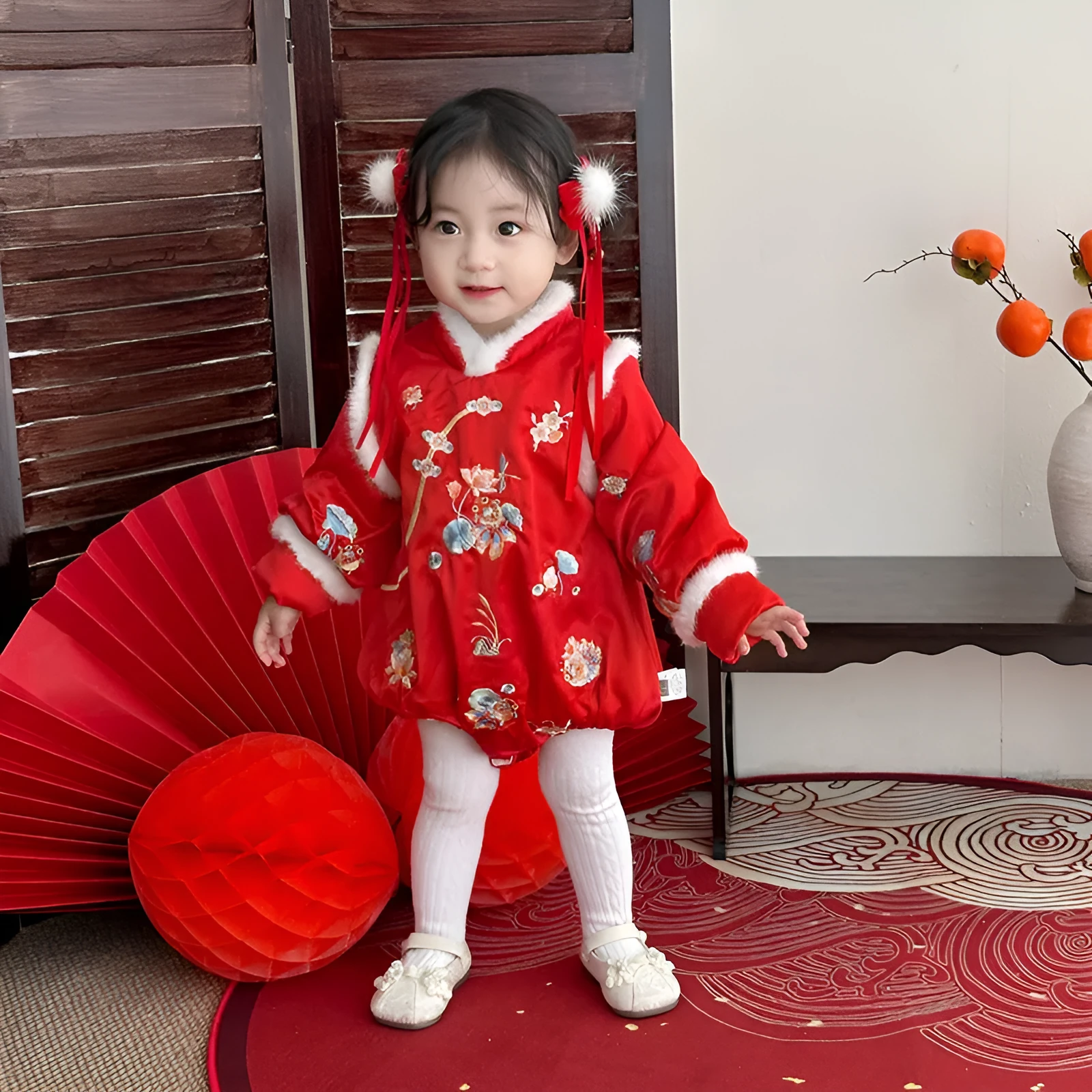 Red thickened baby triangle jumpsuit with long sleeves and pullover style on white background