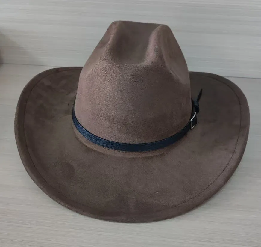 Brown leather velvet cowboy hat with curved brim and conical crown on a wooden post.