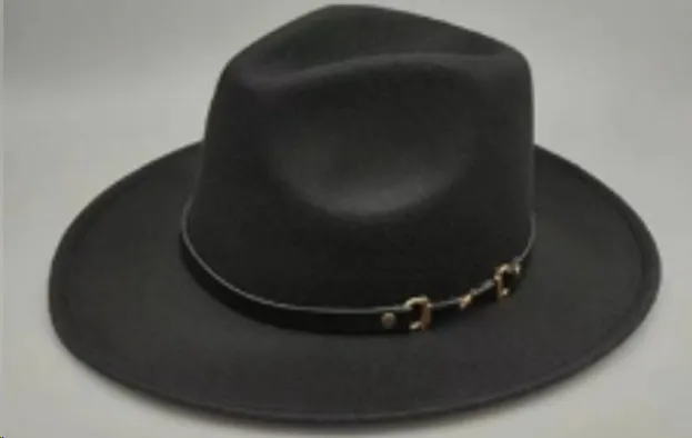 Brown leather velvet cowboy hat with curved brim and conical crown on a wooden post.