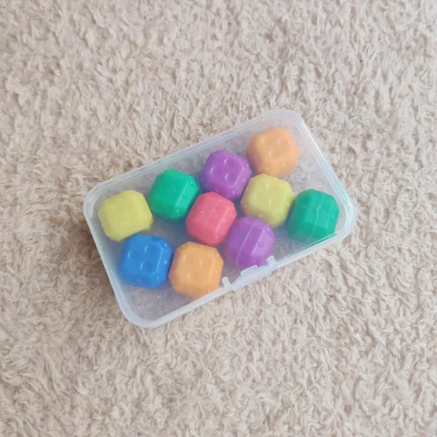 Childhood nostalgic toy claw stone game set with plastic grasping stones in mixed colours