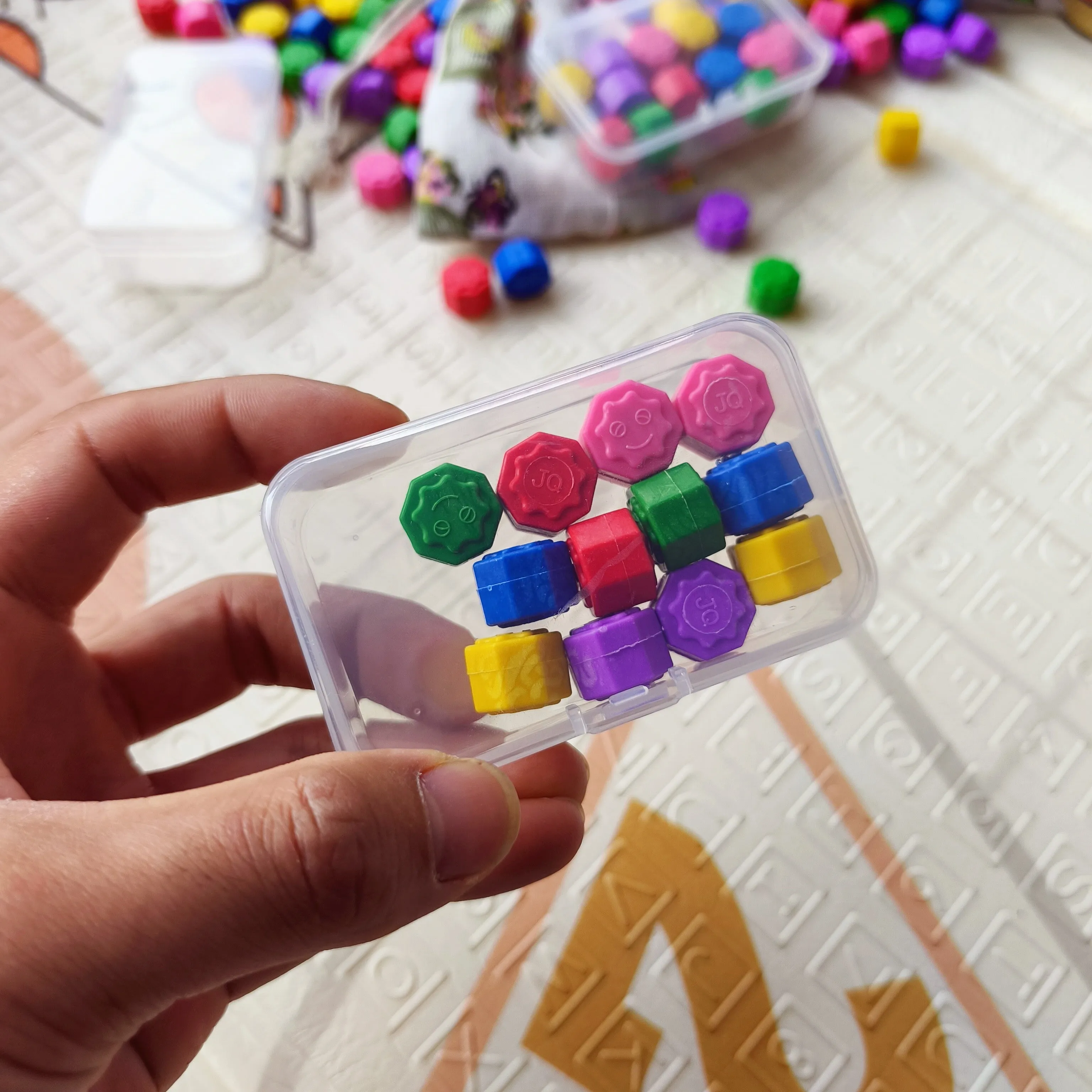 Childhood nostalgic toy claw stone game set with plastic grasping stones in mixed colours