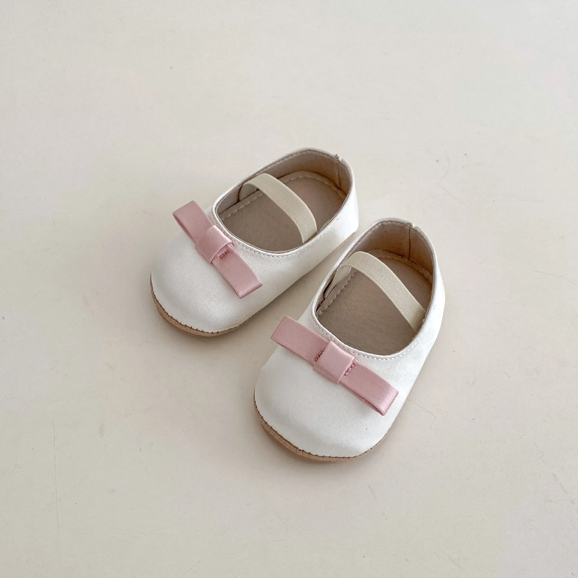 Cute baby butterfly knot shoes in solid colour with bow detail, breathable cloth and rubber sole