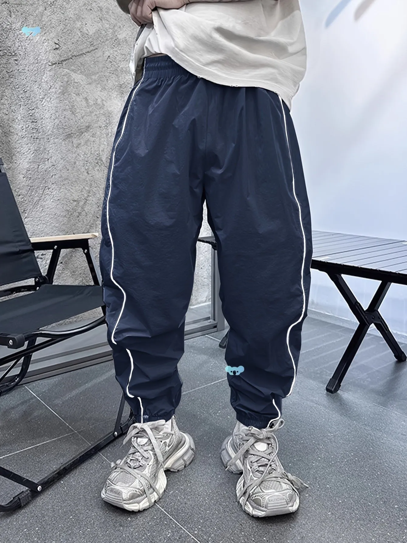 Men's loose fit casual sports trousers in bamboo fibre, shown in cropped length and a colour option like blue.