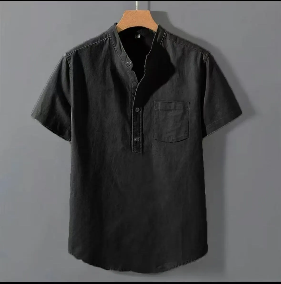 Men's beige casual linen shirt with stand collar and short sleeves in a loose, relaxed fit.