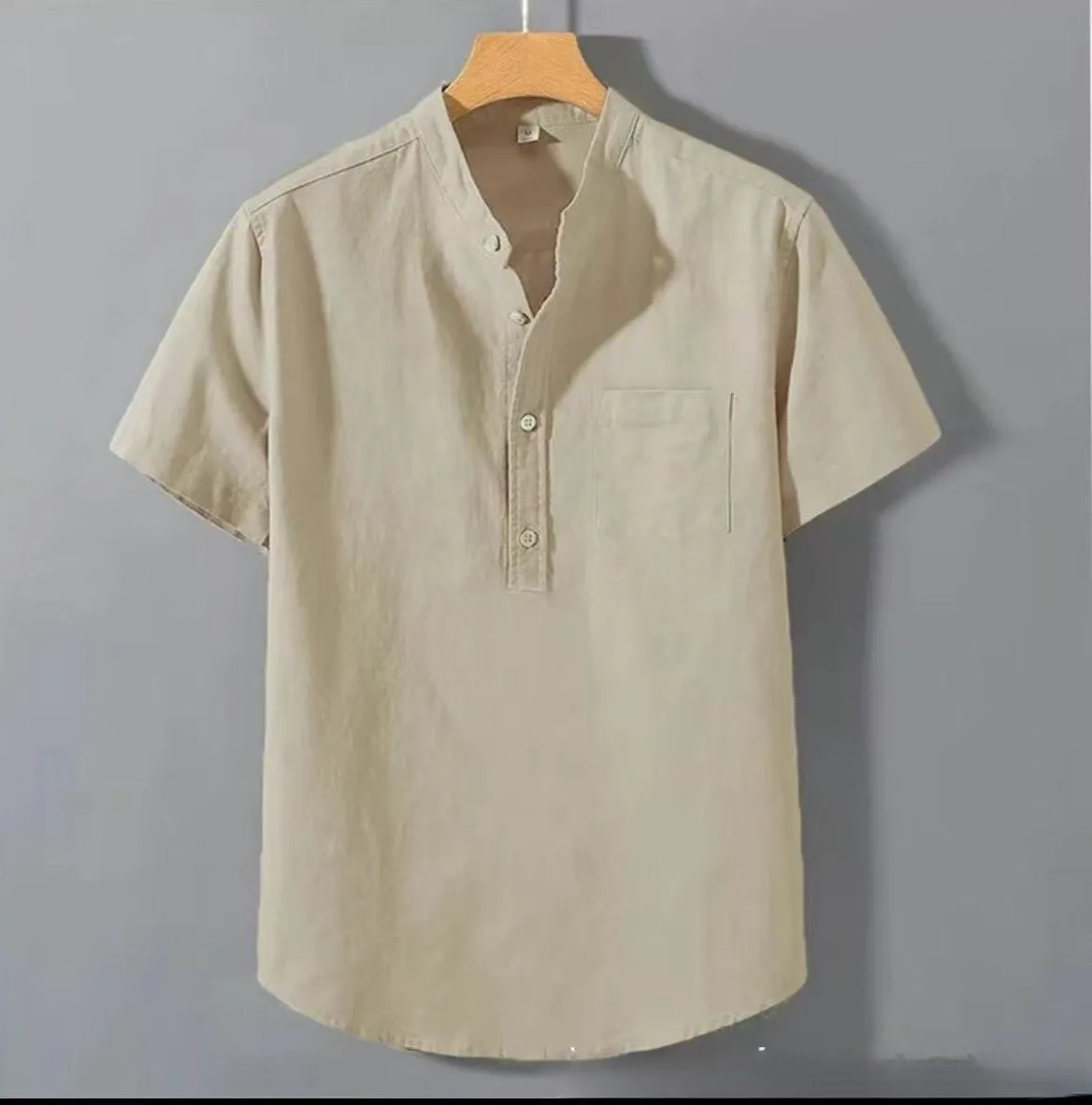 Men's beige casual linen shirt with stand collar and short sleeves in a loose, relaxed fit.