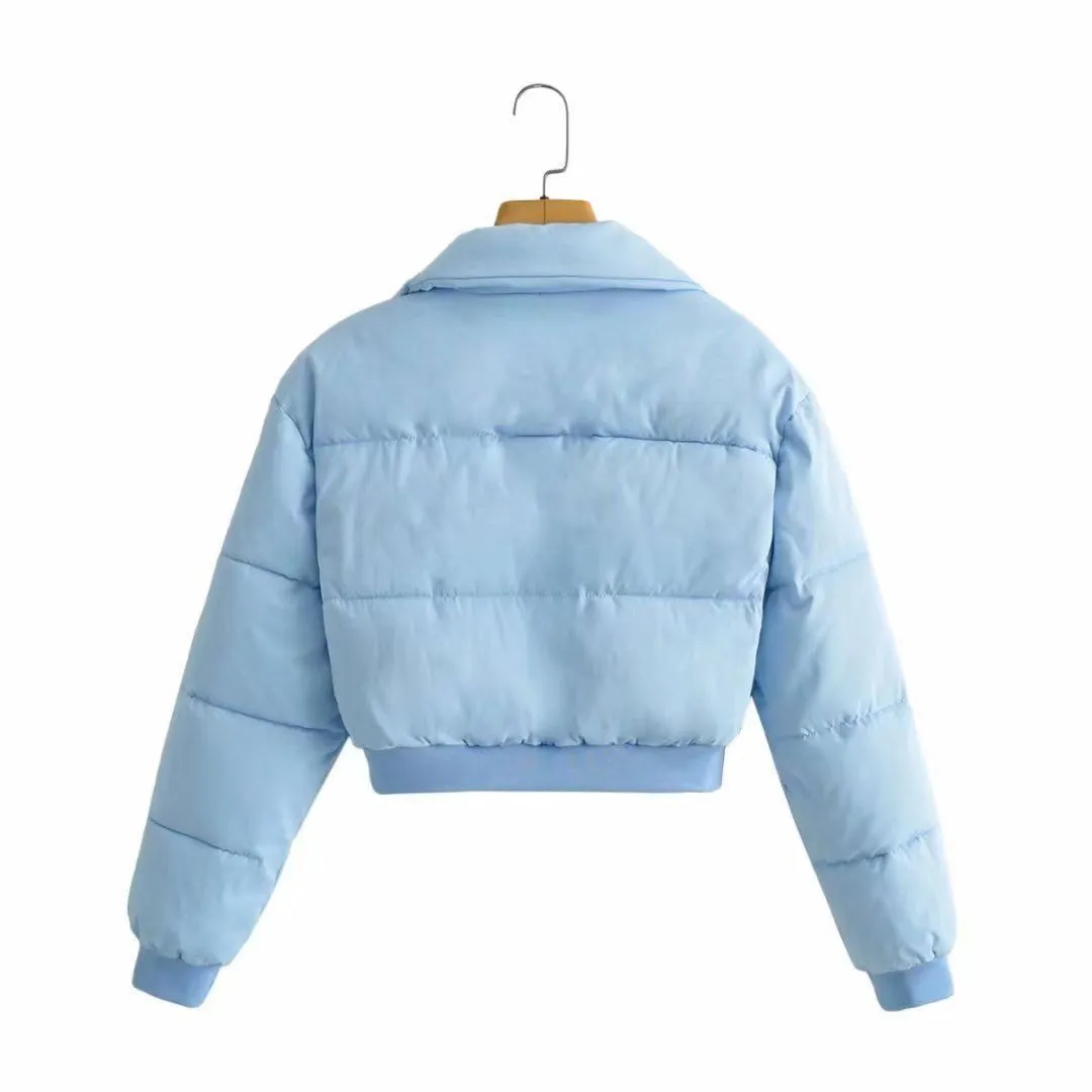 Loose blue polyester jacket for women with long sleeves on hanger