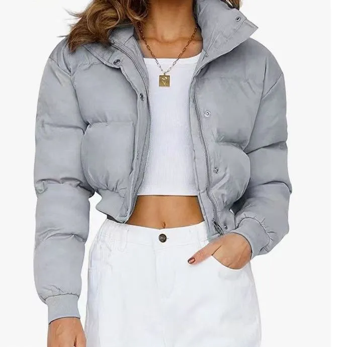 Loose blue polyester jacket for women with long sleeves on hanger