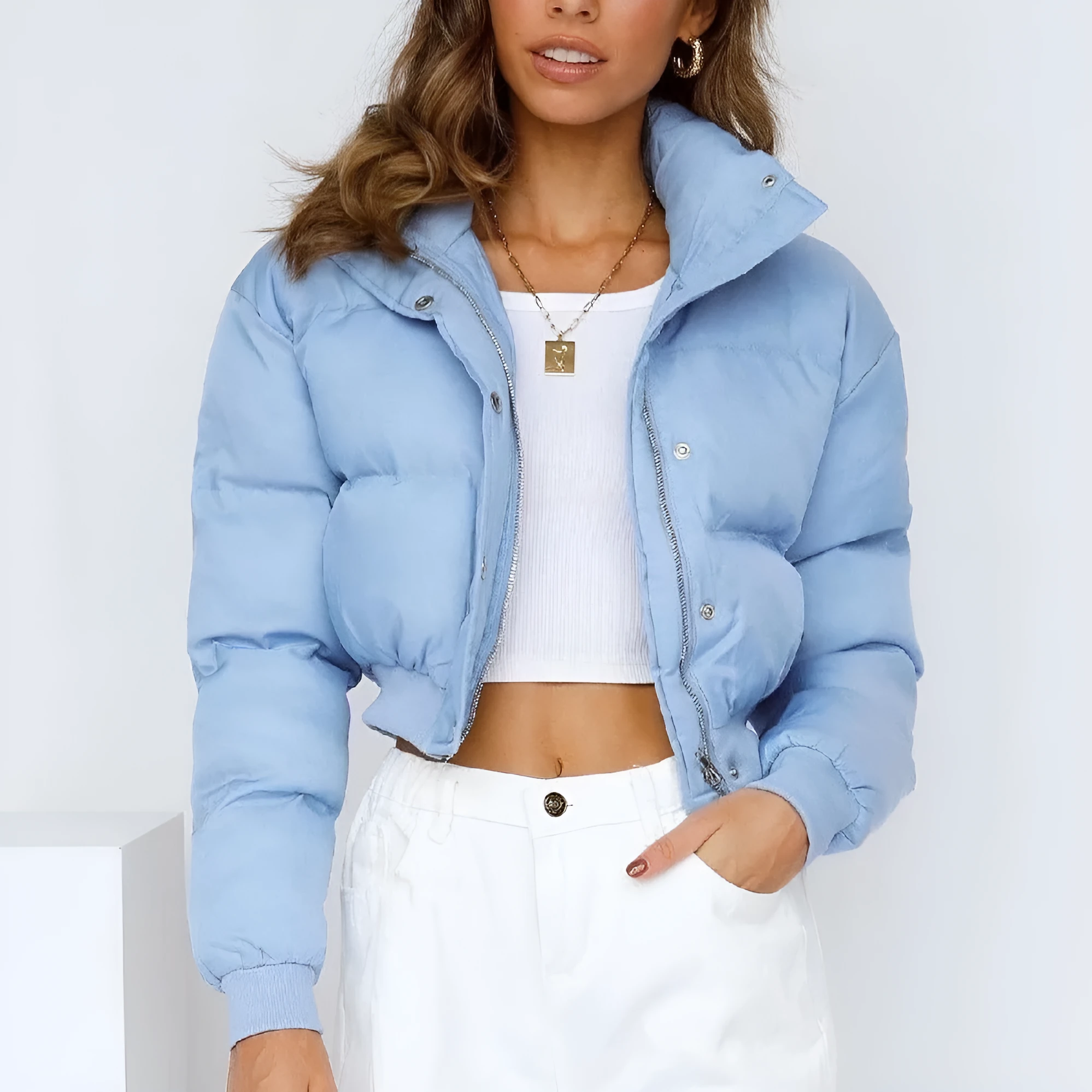 Loose blue polyester jacket for women with long sleeves on hanger