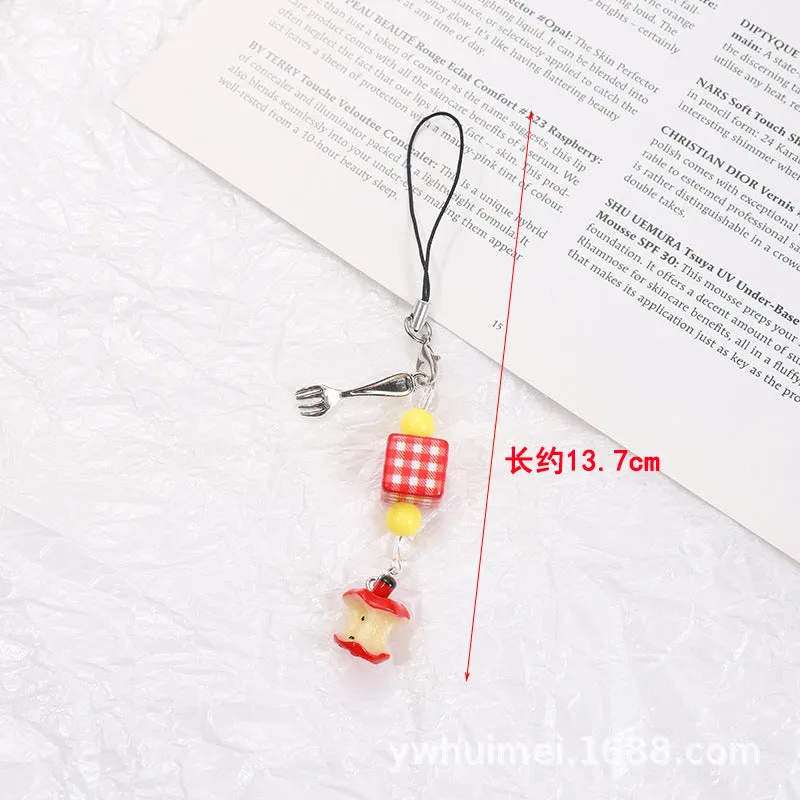 Fruit-themed mobile phone charm keychain with apple and strawberry designs in plastic/resin construction