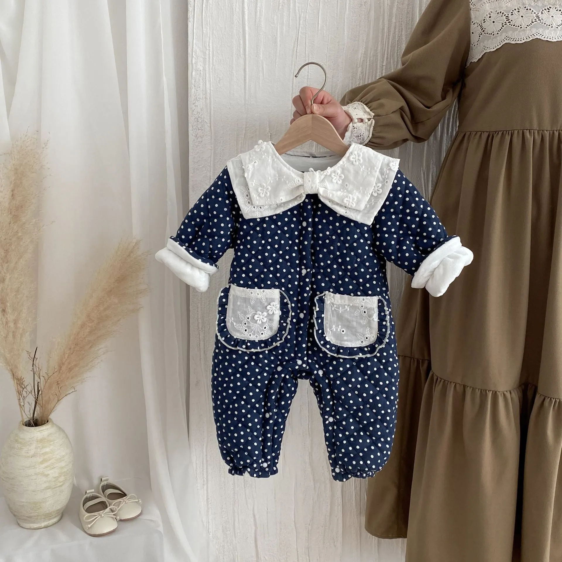 Baby girls winter cotton-padded fleece-lined onesie in dark blue on white background