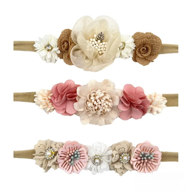 Set of three cloth flower-shaped baby hair bands in different styles