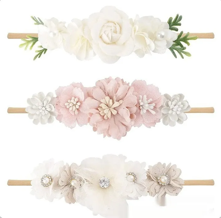 Set of three cloth flower-shaped baby hair bands in different styles