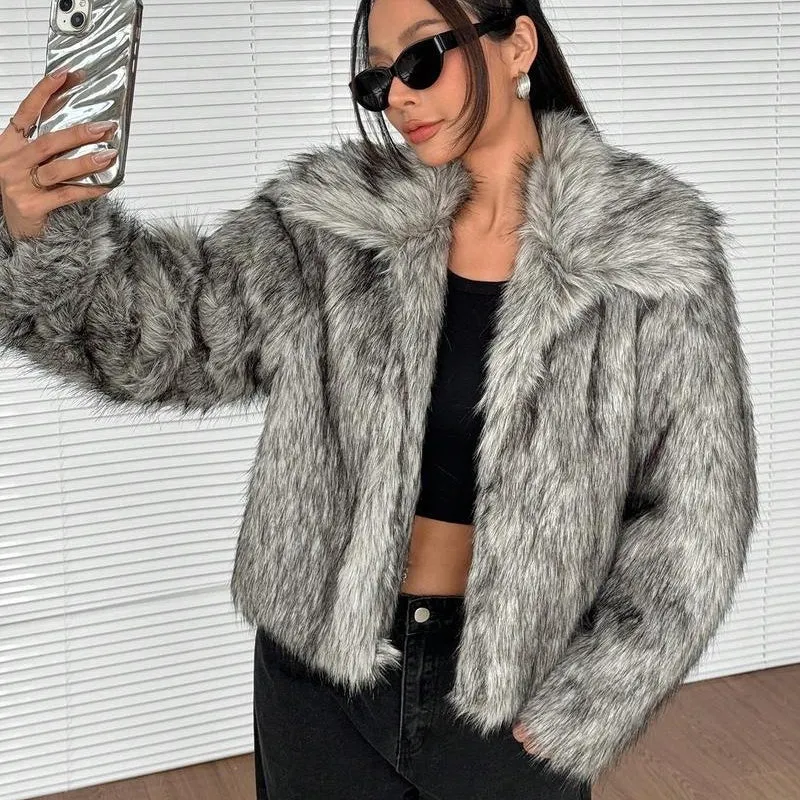 Women's short black tip artificial fur winter coat with a large fur collar and long sleeves.