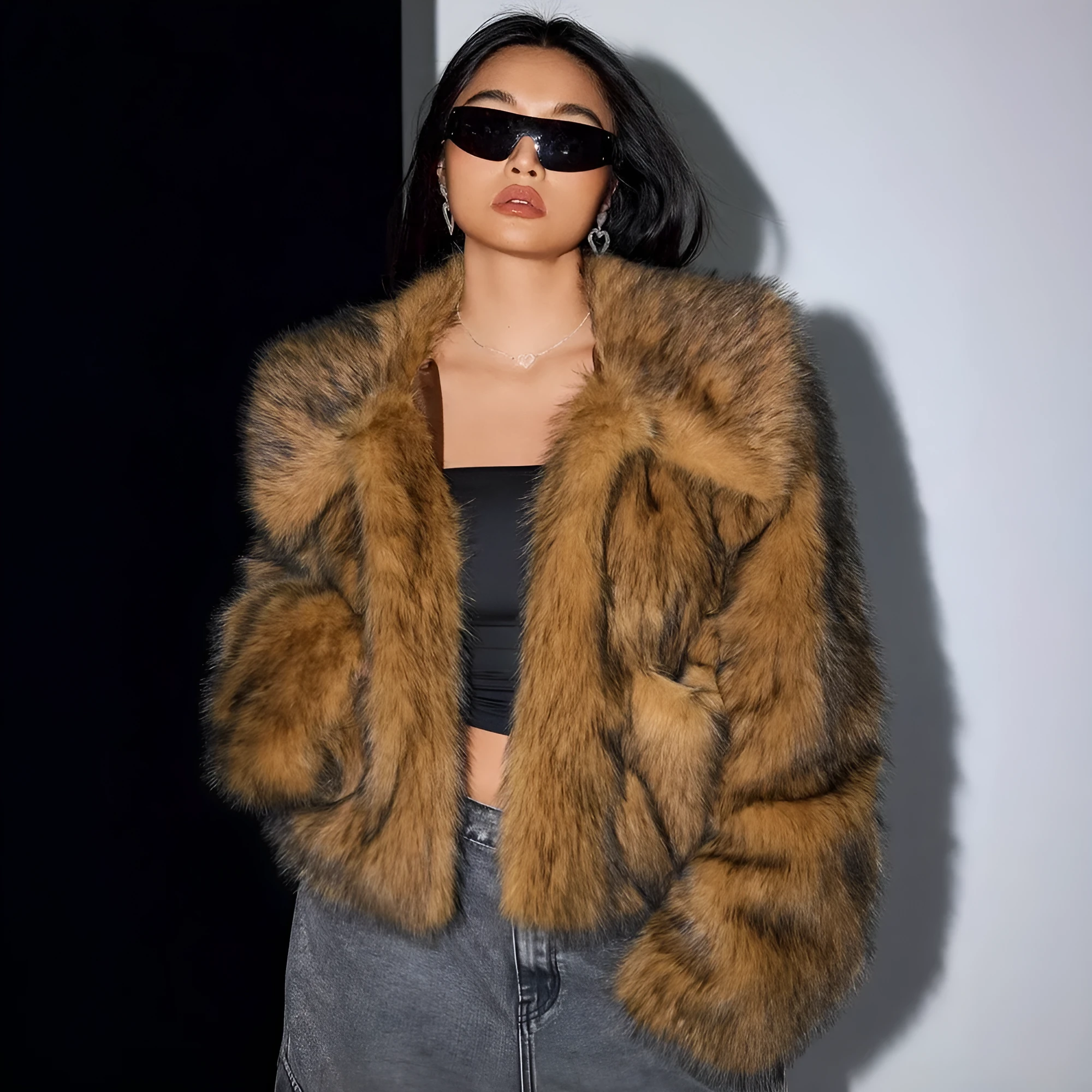 Women's short black tip artificial fur winter coat with a large fur collar and long sleeves.