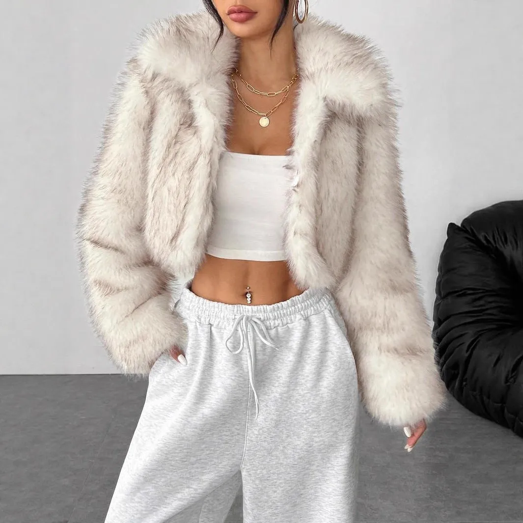 Women's short black tip artificial fur winter coat with a large fur collar and long sleeves.
