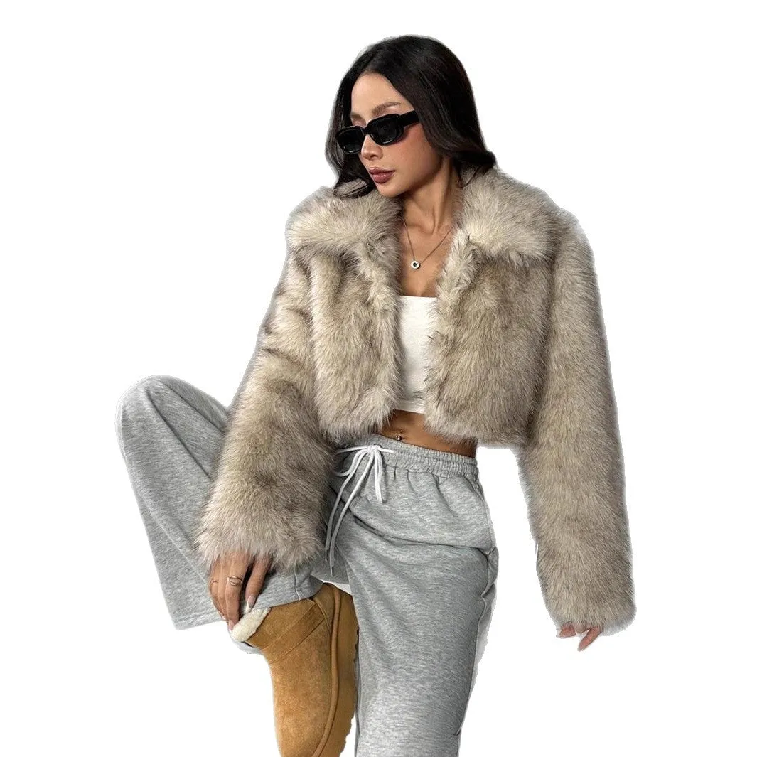 Women's short black tip artificial fur winter coat with a large fur collar and long sleeves.