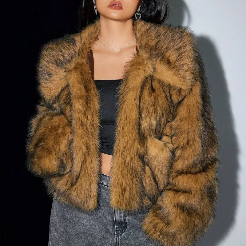 Women's short black tip artificial fur winter coat with a large fur collar and long sleeves.