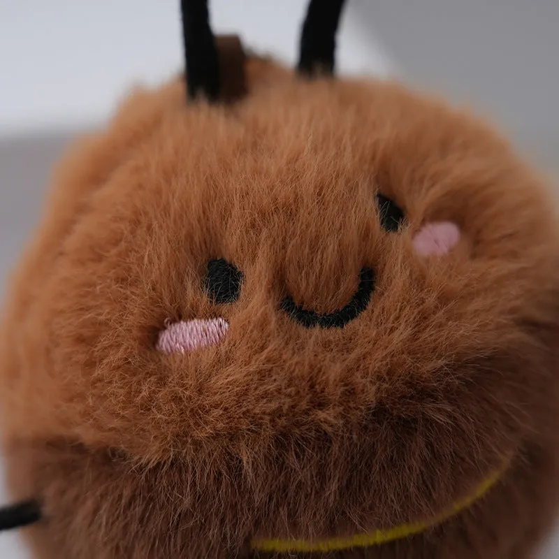 Small mink velvet cockroach pendant plush toy doll with black eyes, 8cm height, on a light background