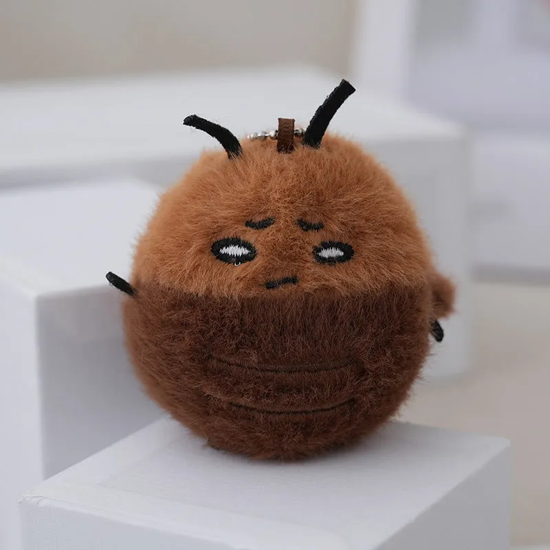 Small mink velvet cockroach pendant plush toy doll with black eyes, 8cm height, on a light background