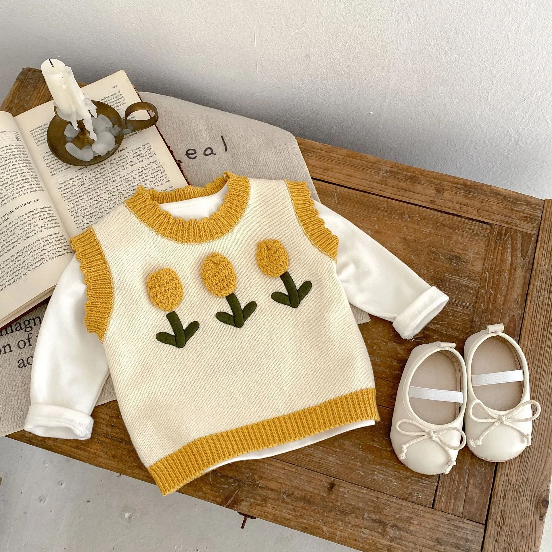 Baby girl sleeveless knitted cotton top with three-dimensional flower in almond white