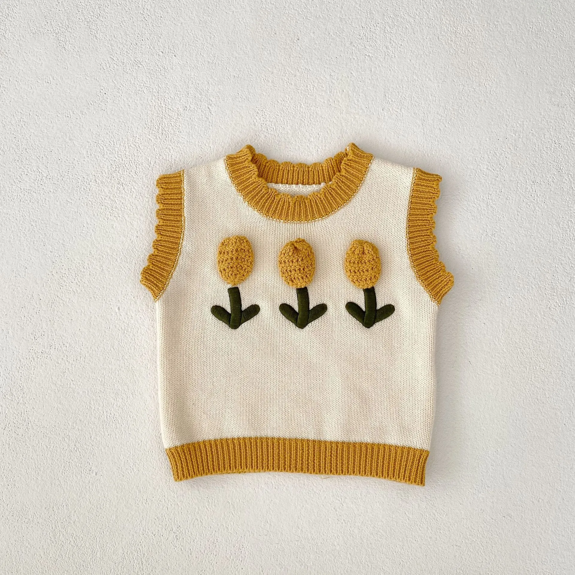 Baby girl sleeveless knitted cotton top with three-dimensional flower in almond white