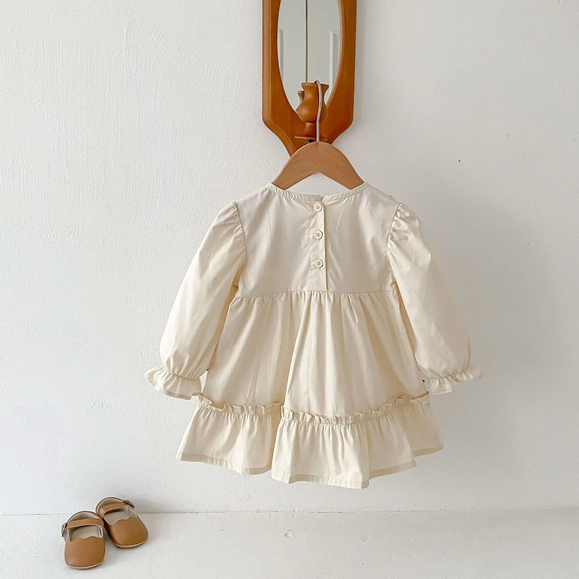 Girls' ruffled long sleeve flower embroidered princess dress in apricot colour on a child model