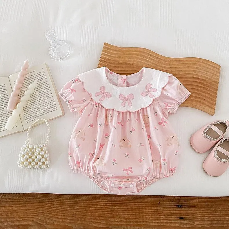 Pink cotton triangle romper jumpsuit for baby girl with three bow details, short sleeves, suitable for height 66-90cm
