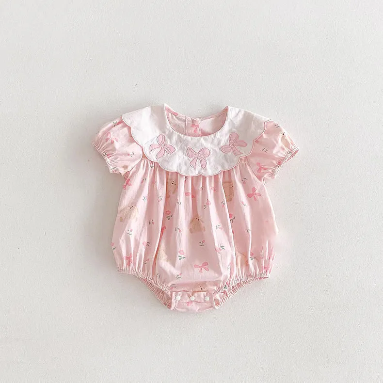 Pink cotton triangle romper jumpsuit for baby girl with three bow details, short sleeves, suitable for height 66-90cm
