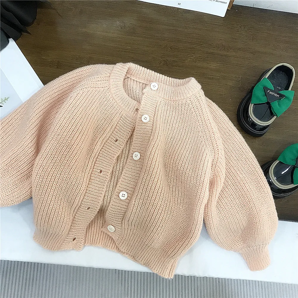 Girls' pink mohair puff sleeve knitted cardigan with orange flower chiffon dress set on white background