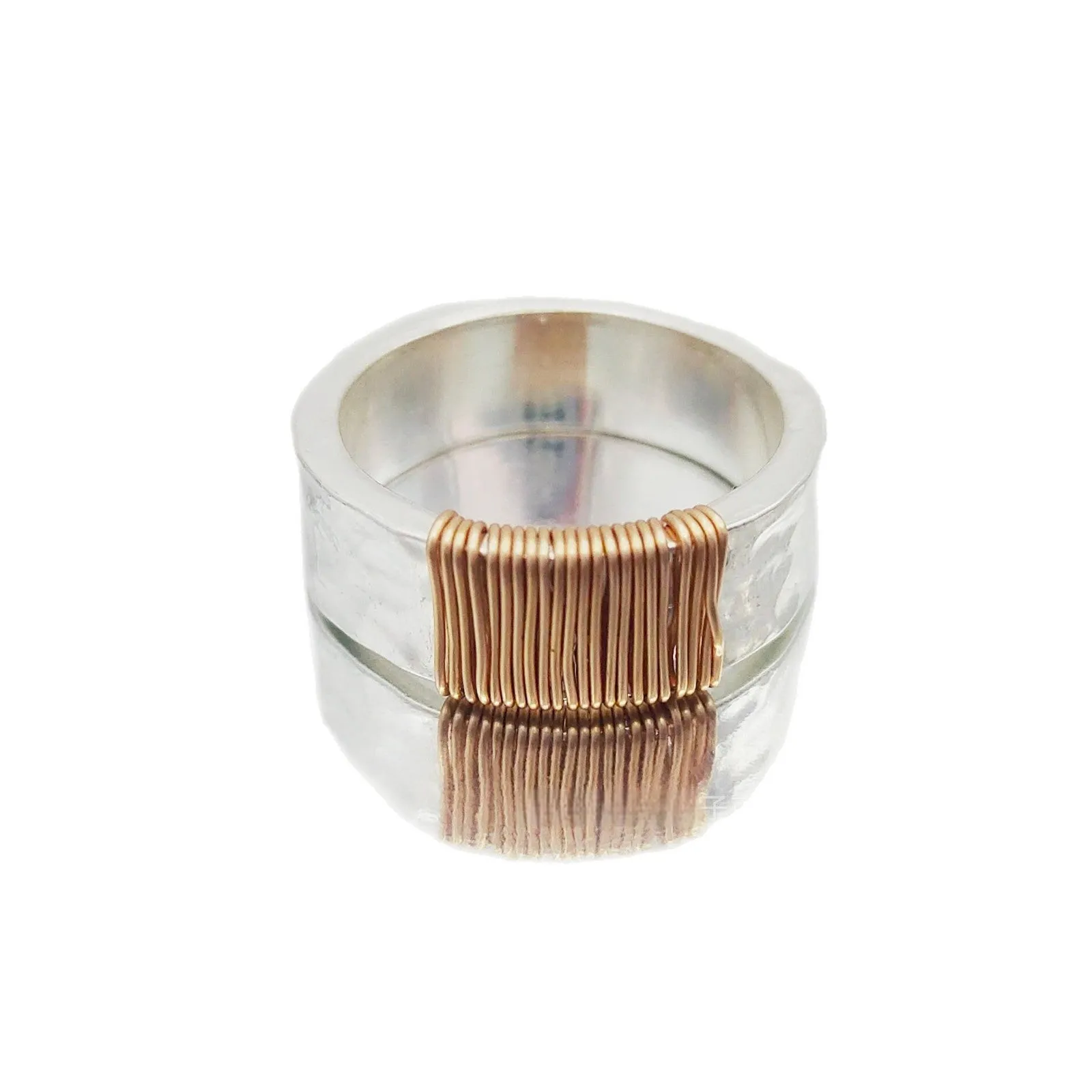 Copper geometric ring with silver golden electroplated finish and irregular vintage coil design.