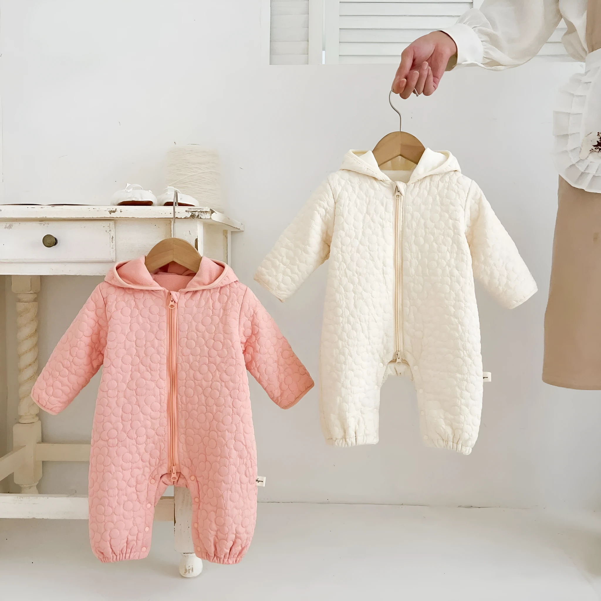 Baby cotton quilted romper with hood in beige, long sleeves, zip-up front