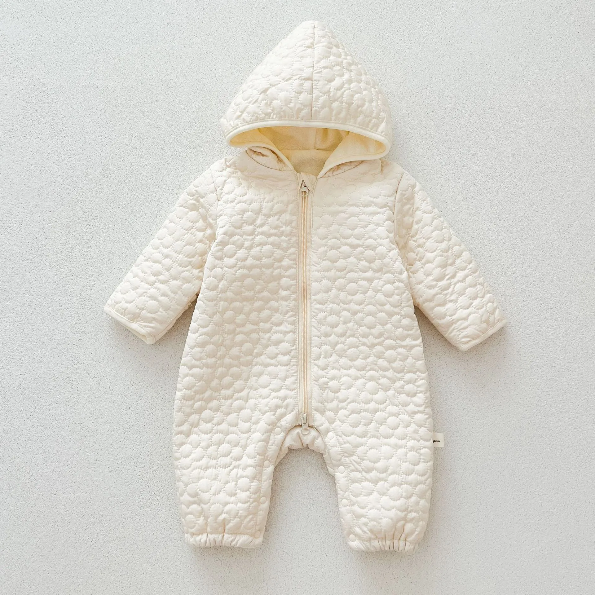 Baby cotton quilted romper with hood in beige, long sleeves, zip-up front