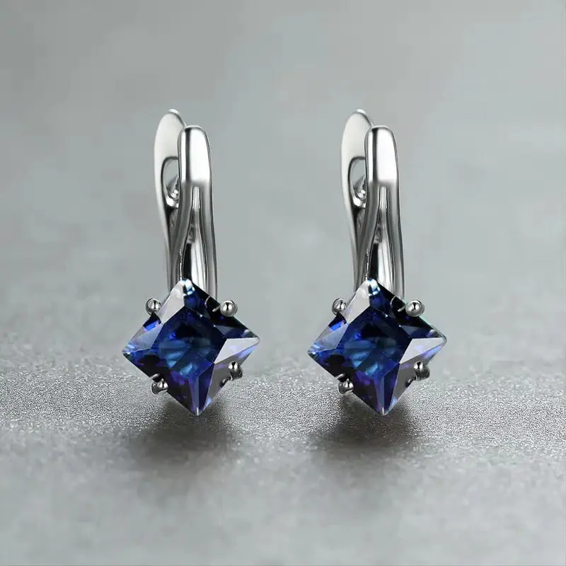 Pair of women's copper earrings with a diamond design and inlaid zircon detailing.