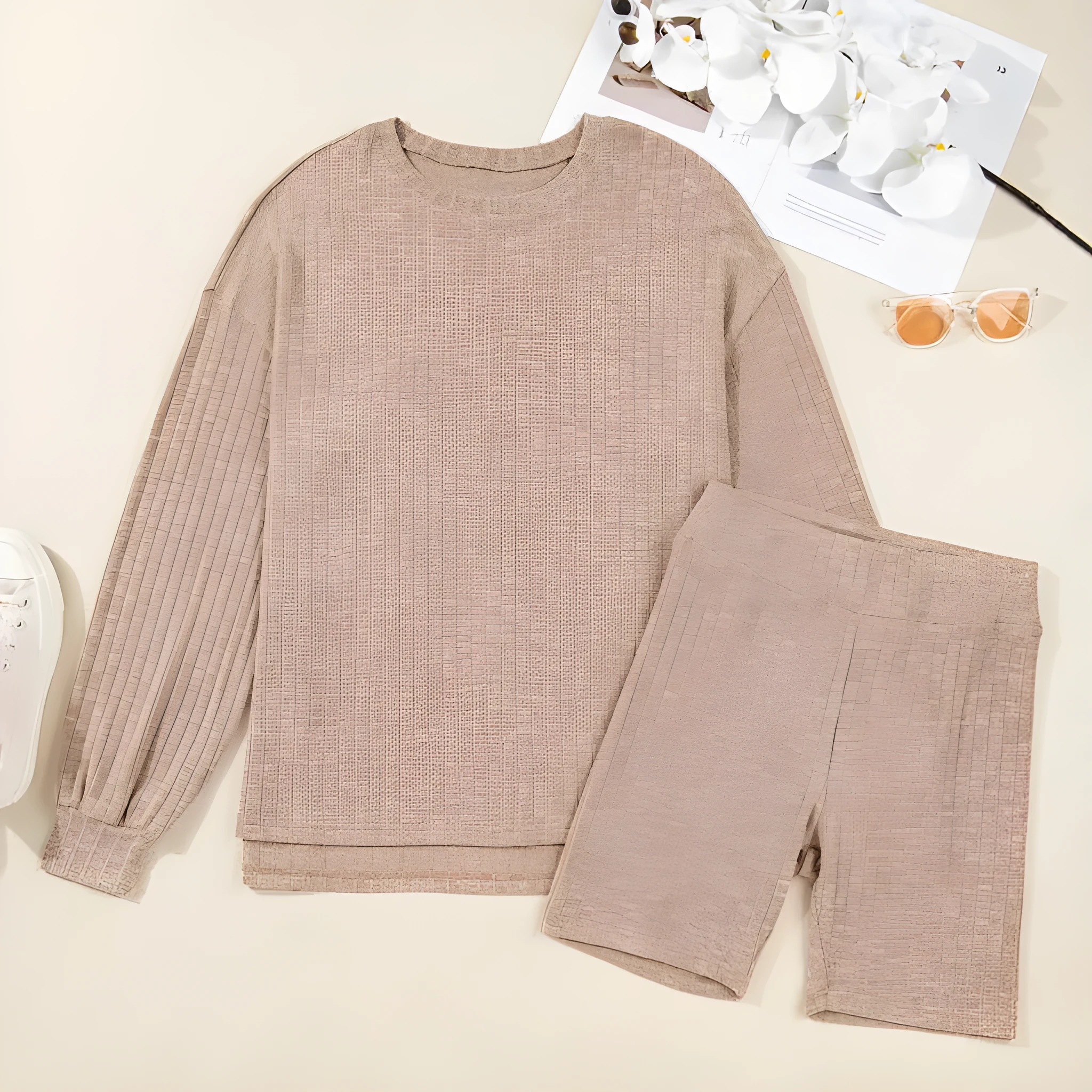 Dark khaki ribbed lantern sleeve sweater and motorcycle knit shorts set on display