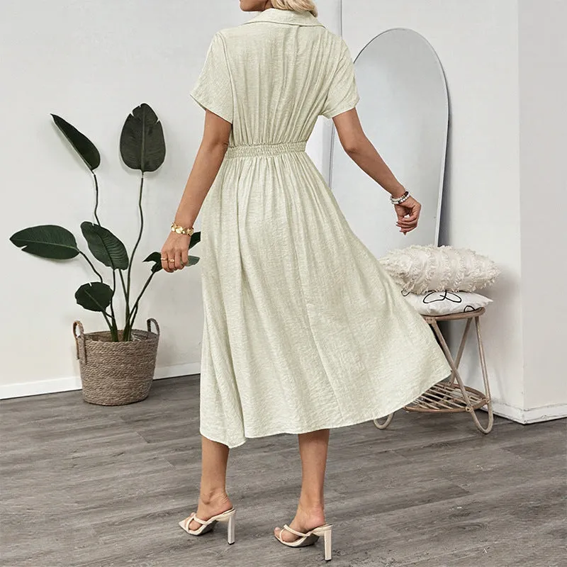 Light green commuter shirt dress with lapel collar, waist tie, and side pockets on a hanger.