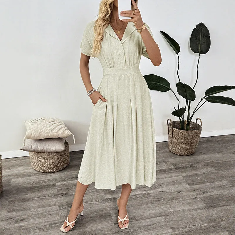 Light green commuter shirt dress with lapel collar, waist tie, and side pockets on a hanger.