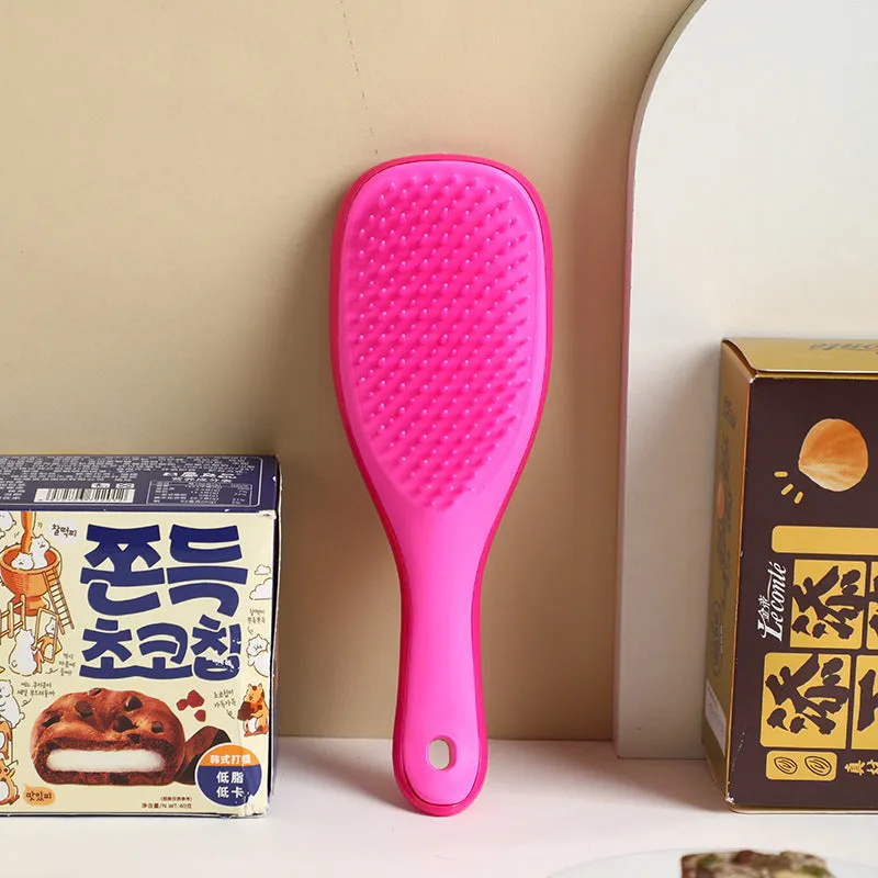 TT Air Curling Massage Home Princess Comb in pink, a plastic air-cushion hairbrush with massage tips