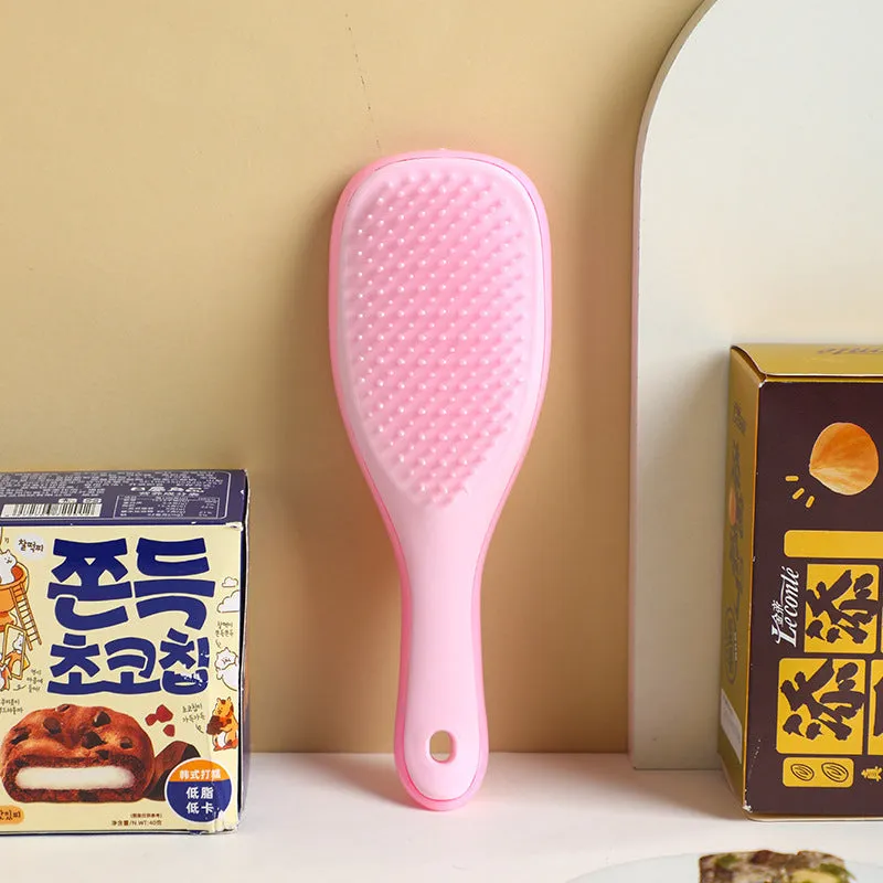 TT Air Curling Massage Home Princess Comb in pink, a plastic air-cushion hairbrush with massage tips