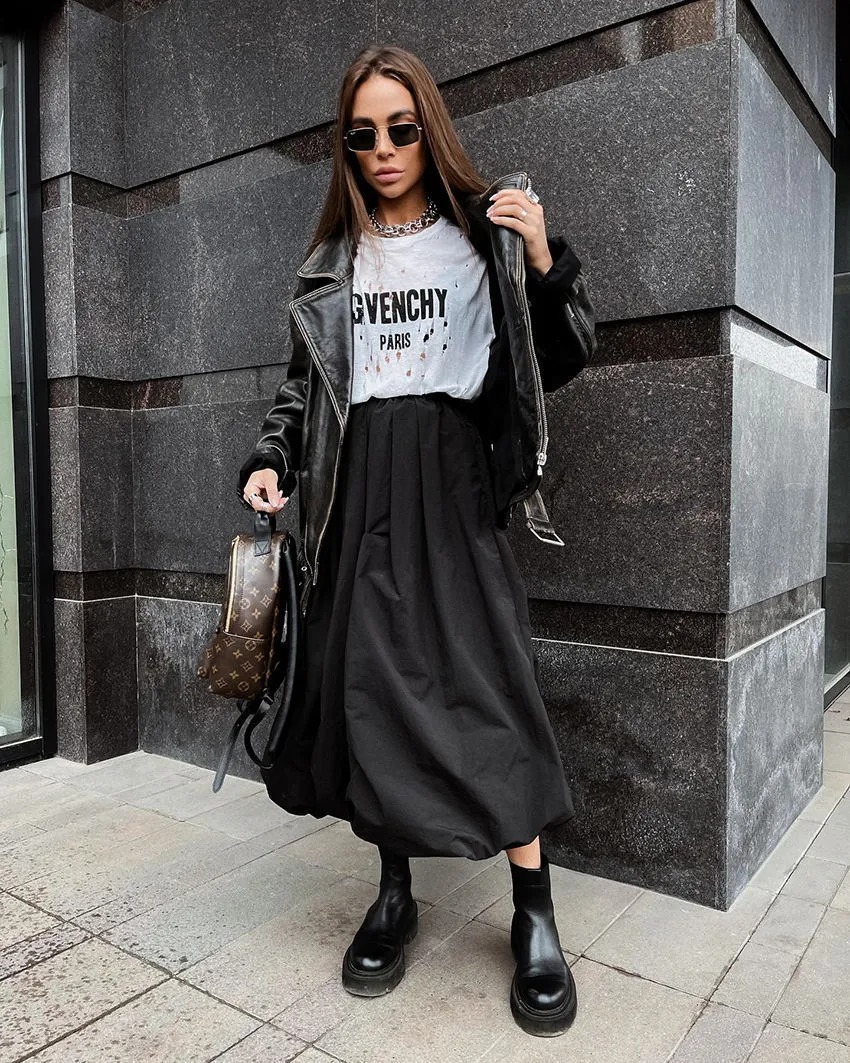 Women's solid colour cotton long skirt with elastic waistband in black or white.