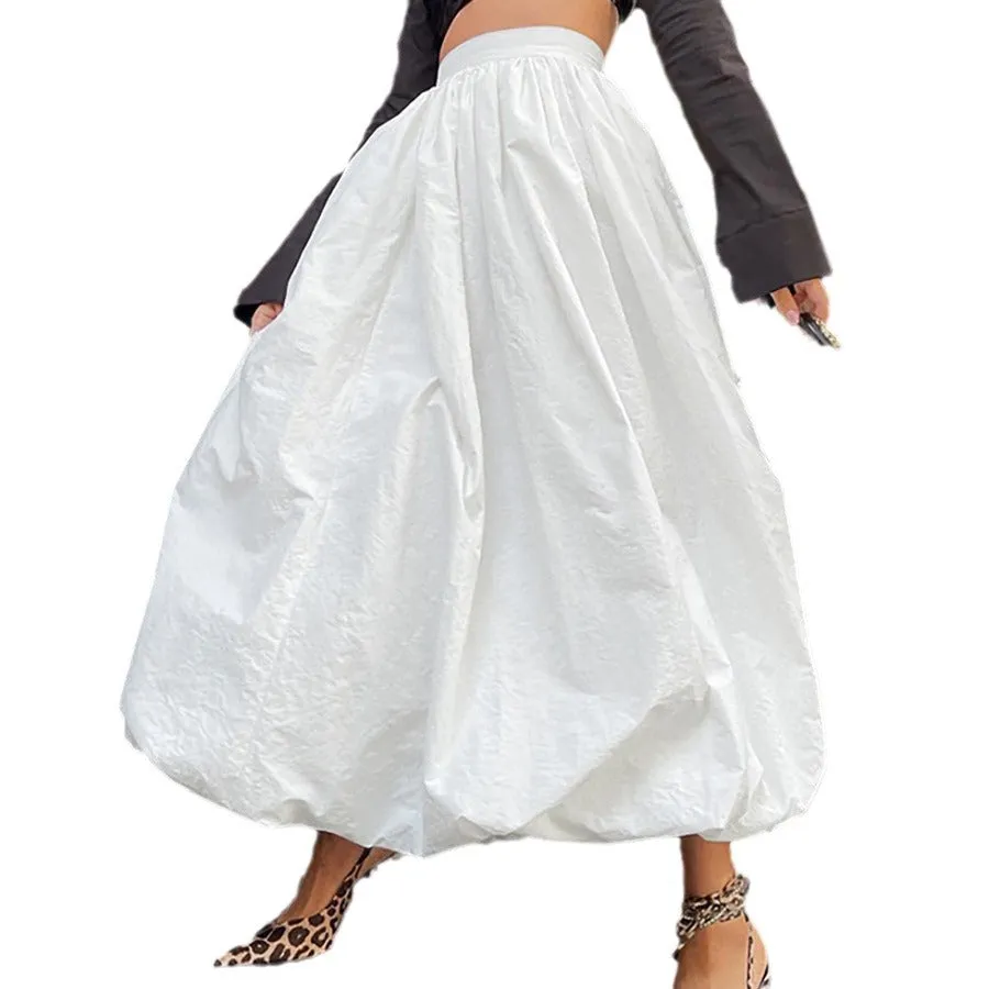 Women's solid colour cotton long skirt with elastic waistband in black or white.