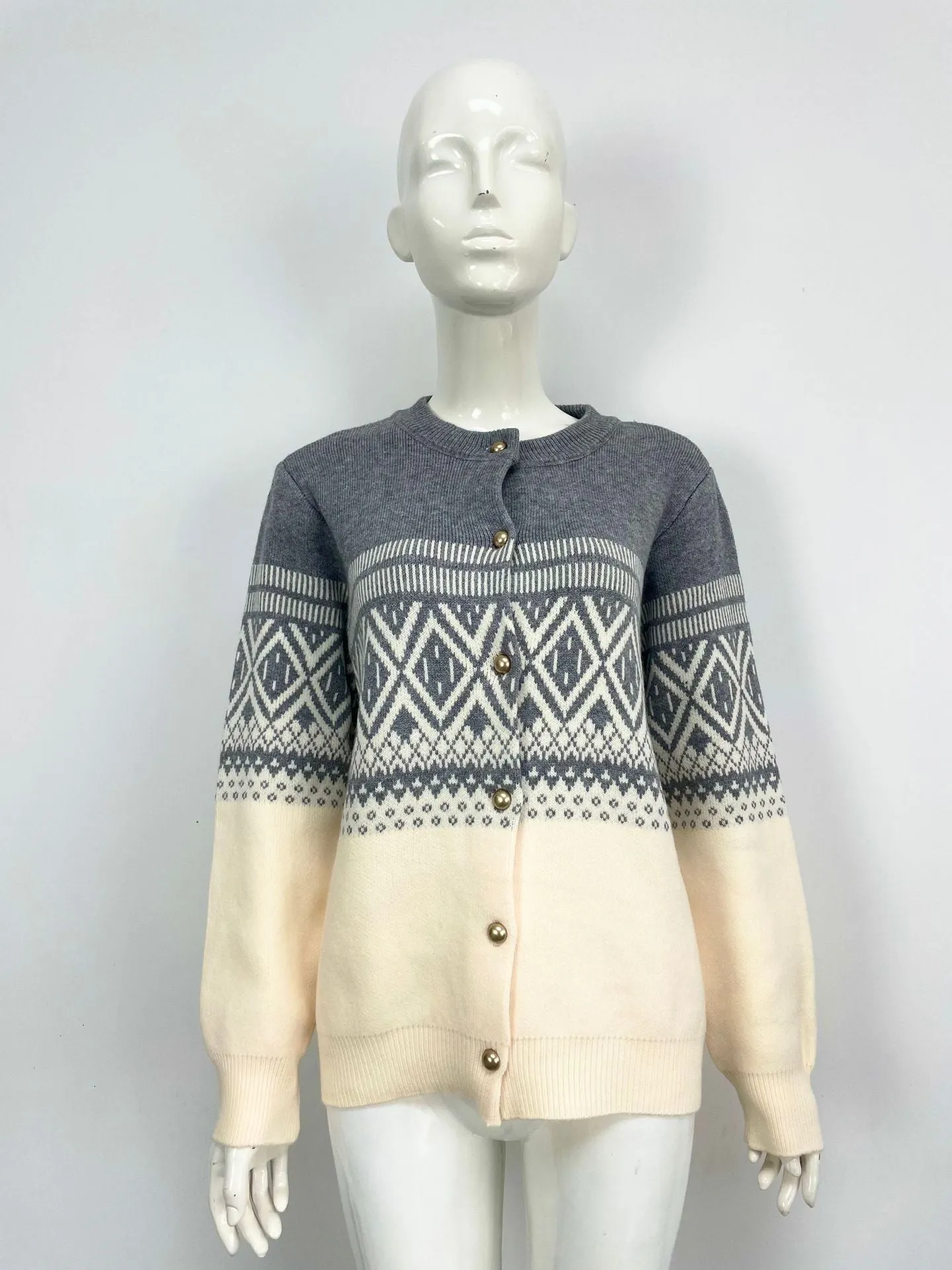 Grey women's alpaca wool cardigan with diamond knit pattern and contrast colour long sleeves.