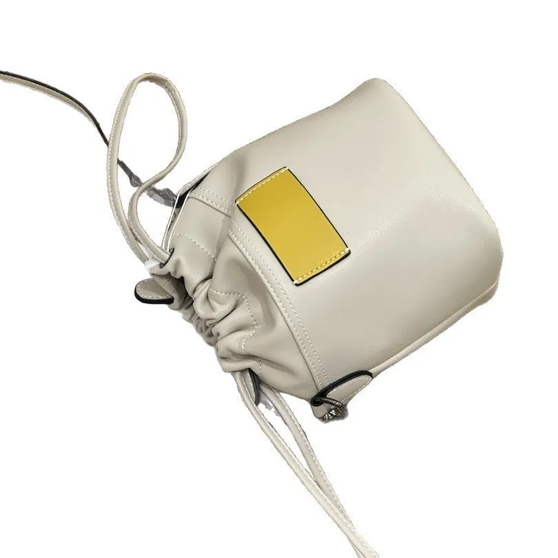 Cortex women's genuine leather drawstring bucket crossbody bag in brown with patchwork design