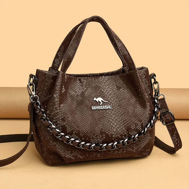 Genuine leather horizontal square shoulder bag with chain detail and snakeskin texture, multiple zippered compartments, available in various colours