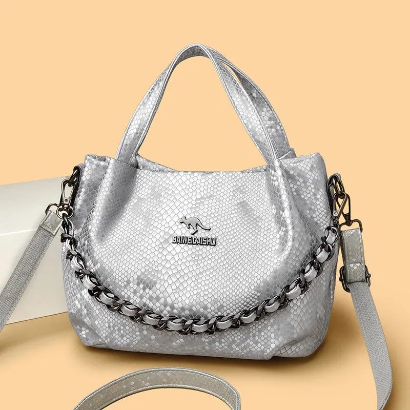 Genuine leather horizontal square shoulder bag with chain detail and snakeskin texture, multiple zippered compartments, available in various colours