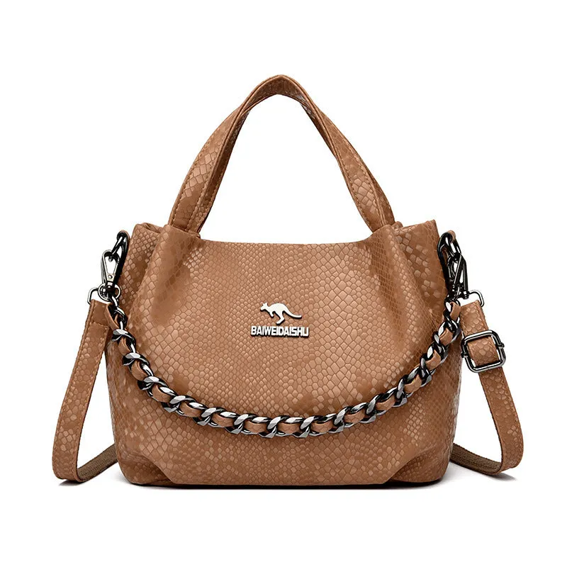 Genuine leather horizontal square shoulder bag with chain detail and snakeskin texture, multiple zippered compartments, available in various colours