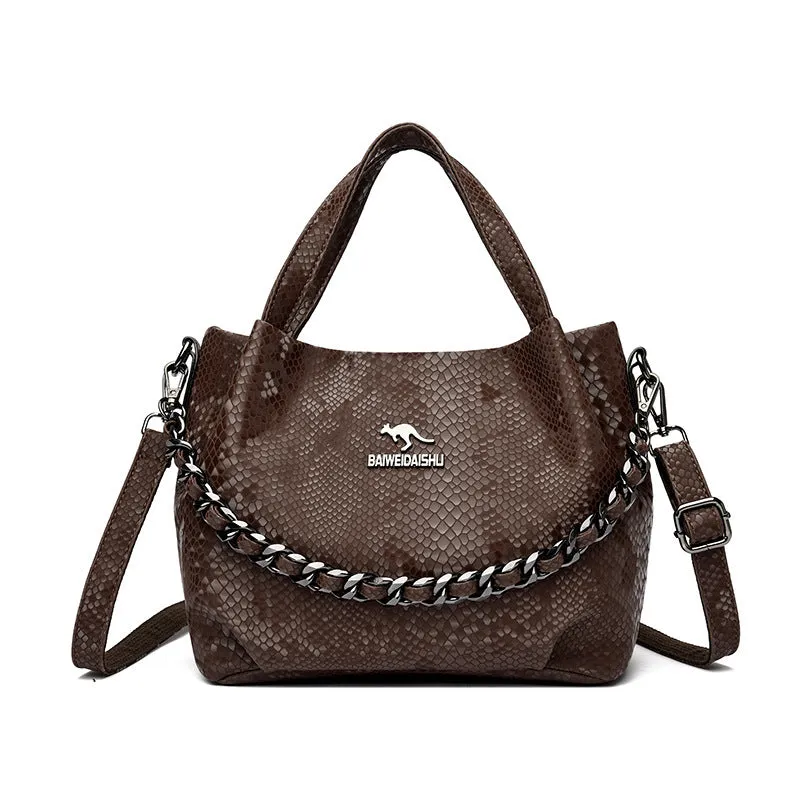 Genuine leather horizontal square shoulder bag with chain detail and snakeskin texture, multiple zippered compartments, available in various colours