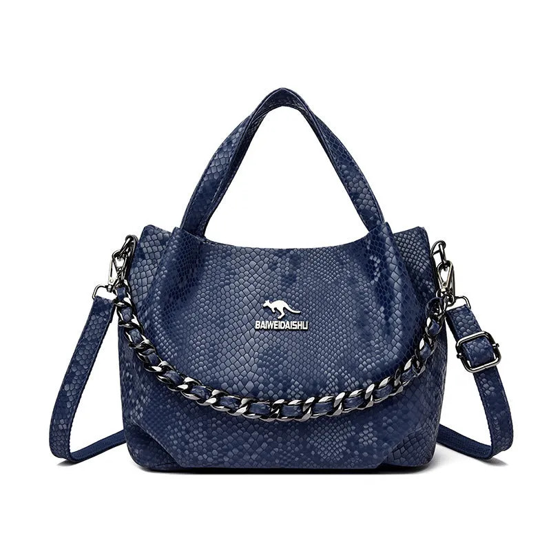Genuine leather horizontal square shoulder bag with chain detail and snakeskin texture, multiple zippered compartments, available in various colours