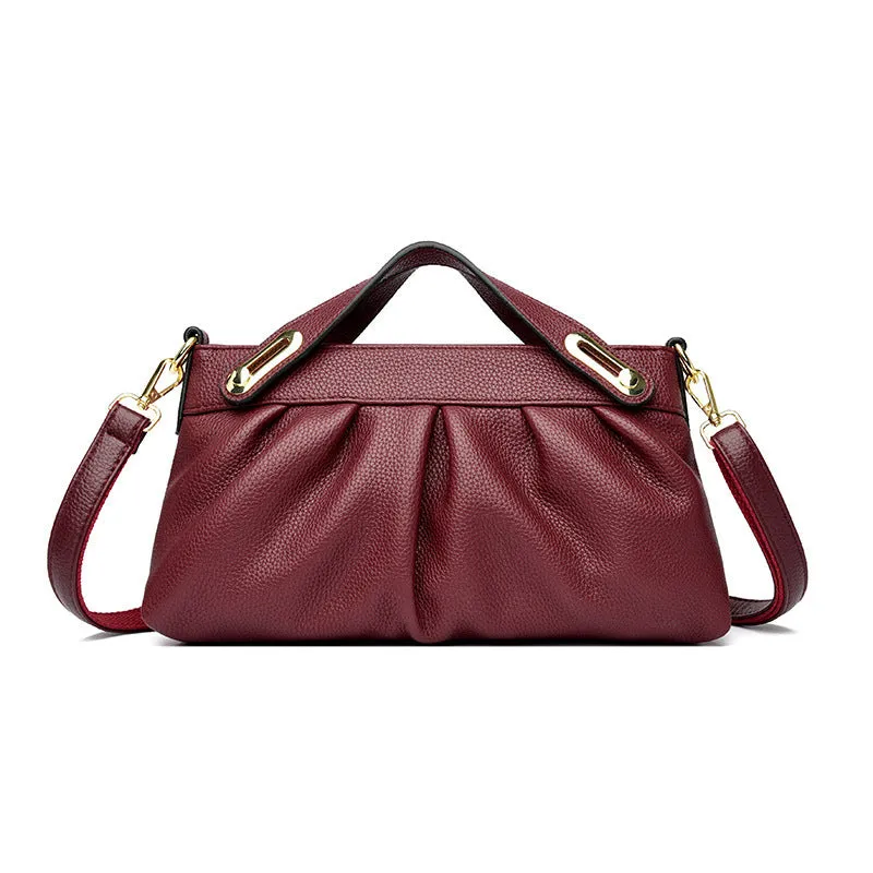 Genuine leather crossbody bag with pleated shoulder strap and wrinkled composite leather finish in horizontal square shape