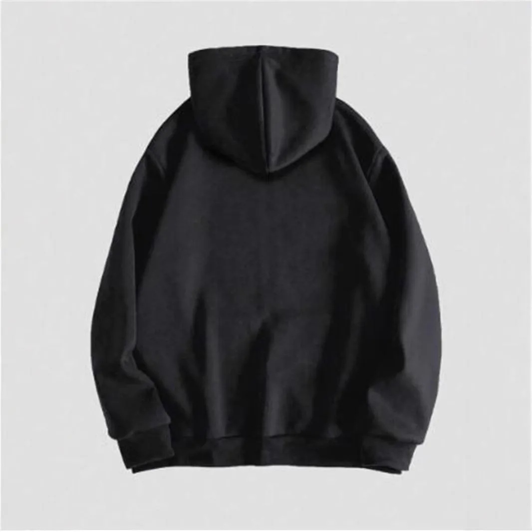 Man wearing a black hooded sweatshirt with a large white skull print on the front.